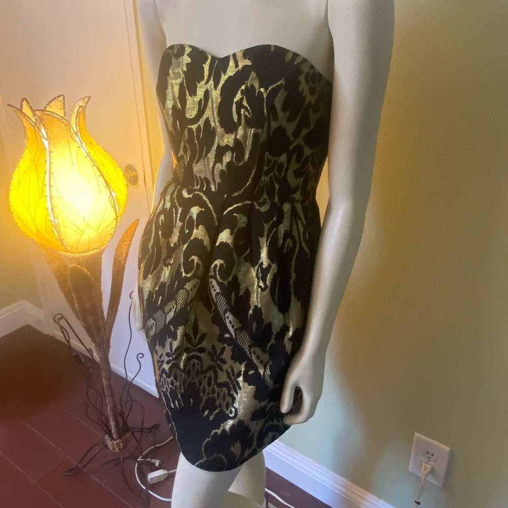 “New Arrivals” Brand-new H&M cocktail dress In Size 8 Black With Matching Gold.